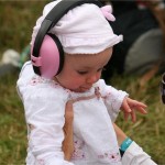 A very young fan enjoys the opening set on Other stage.